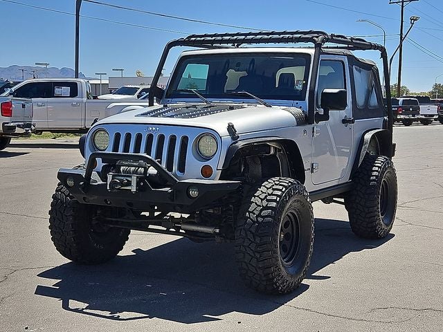 2007 Jeep Wrangler Sahara in Silver — front three-quarter view