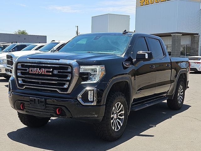 2021 GMC Sierra 1500 AT4 in Ebony Twilight Metallic — front three-quarter view